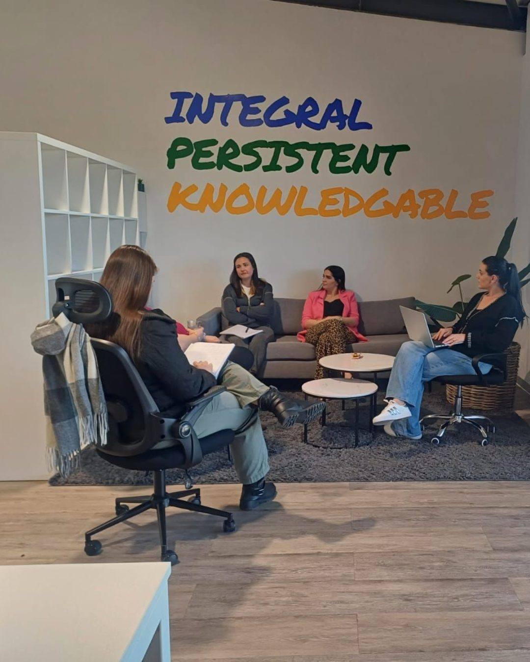 Colleagues in an informal meeting in a Cape Town office lounge