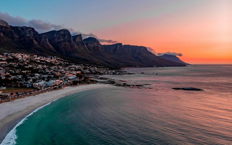 Camps Bay coastline and mountains at sunset, Cape Town